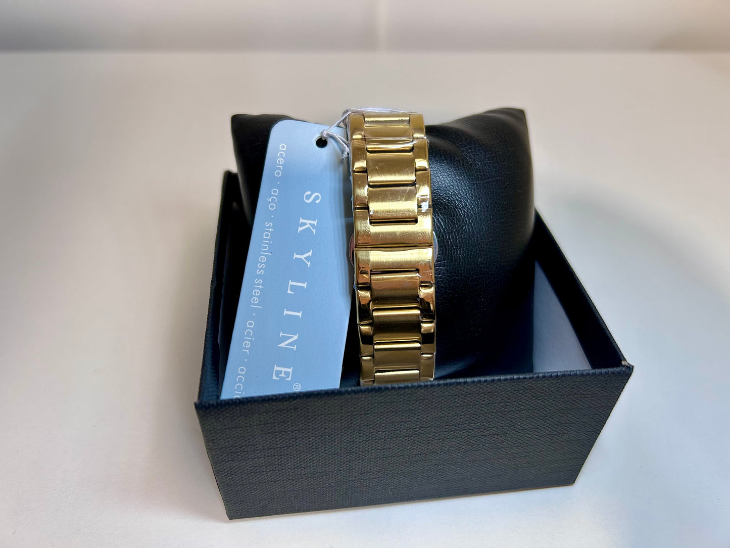 RELOJ SKYLINE DORADO