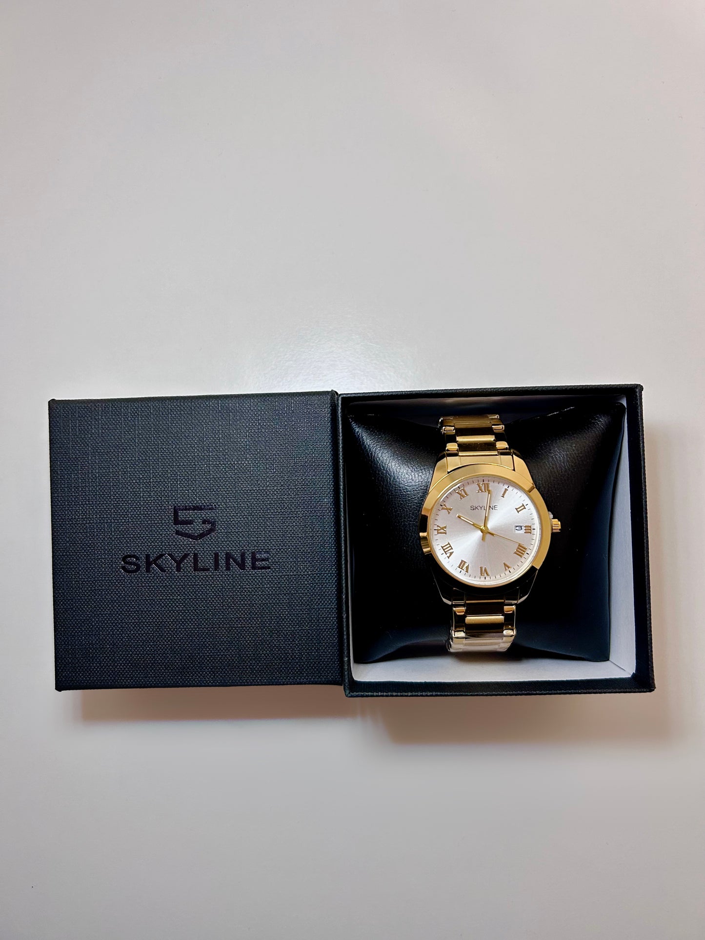 RELOJ SKYLINE DORADO