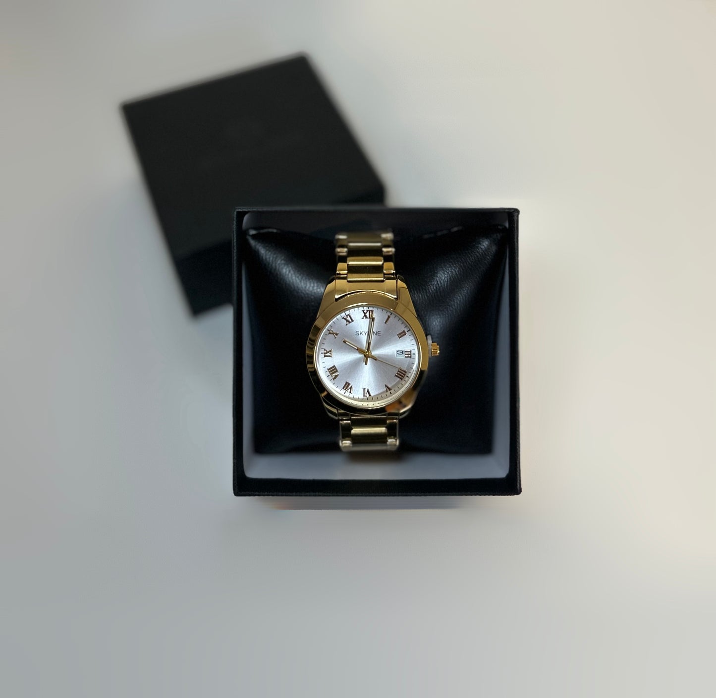 RELOJ SKYLINE DORADO
